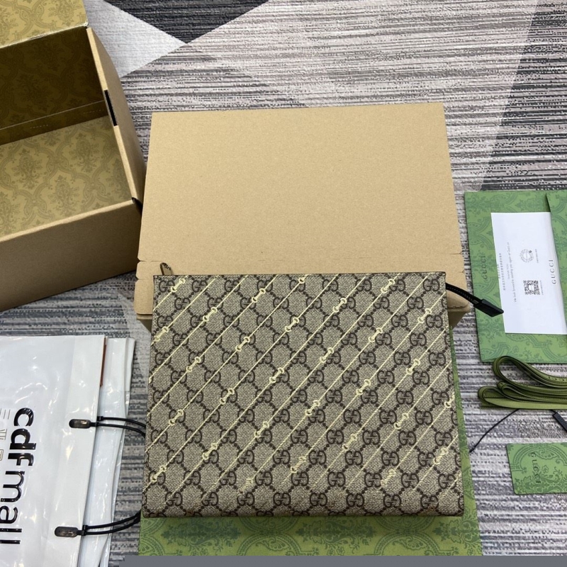 G*u*i clutch bags